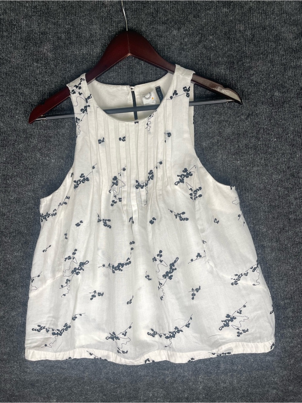 Anthropologie White Sleeveless Pintuck Tank with Navy Floral Motif